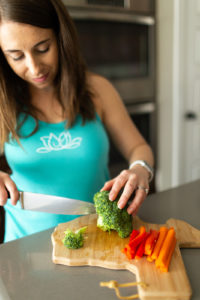 female chopping vegetables